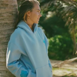 pink-palm-puff-everything-comes-in-waves-blue-hoodie